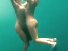 Busty naked swimmers make erotic underwater art