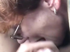 Granny with glasses sucking dick in the car