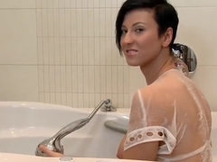 Busty Brunette Rubs Her Pussy In Bath Tub